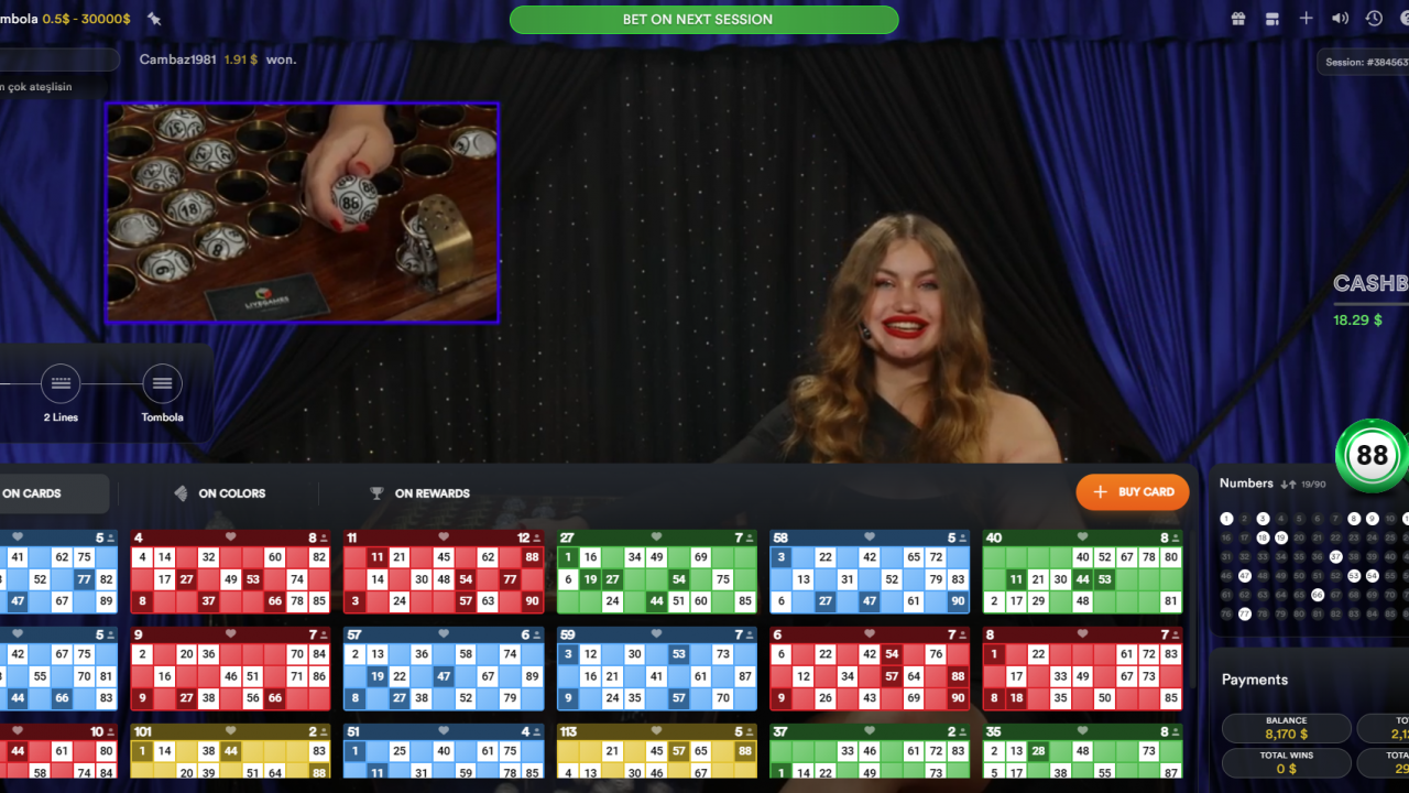 Screenshot from a live round of Live Tombola, featuring the live dealer calling numbers and active bingo gameplay.