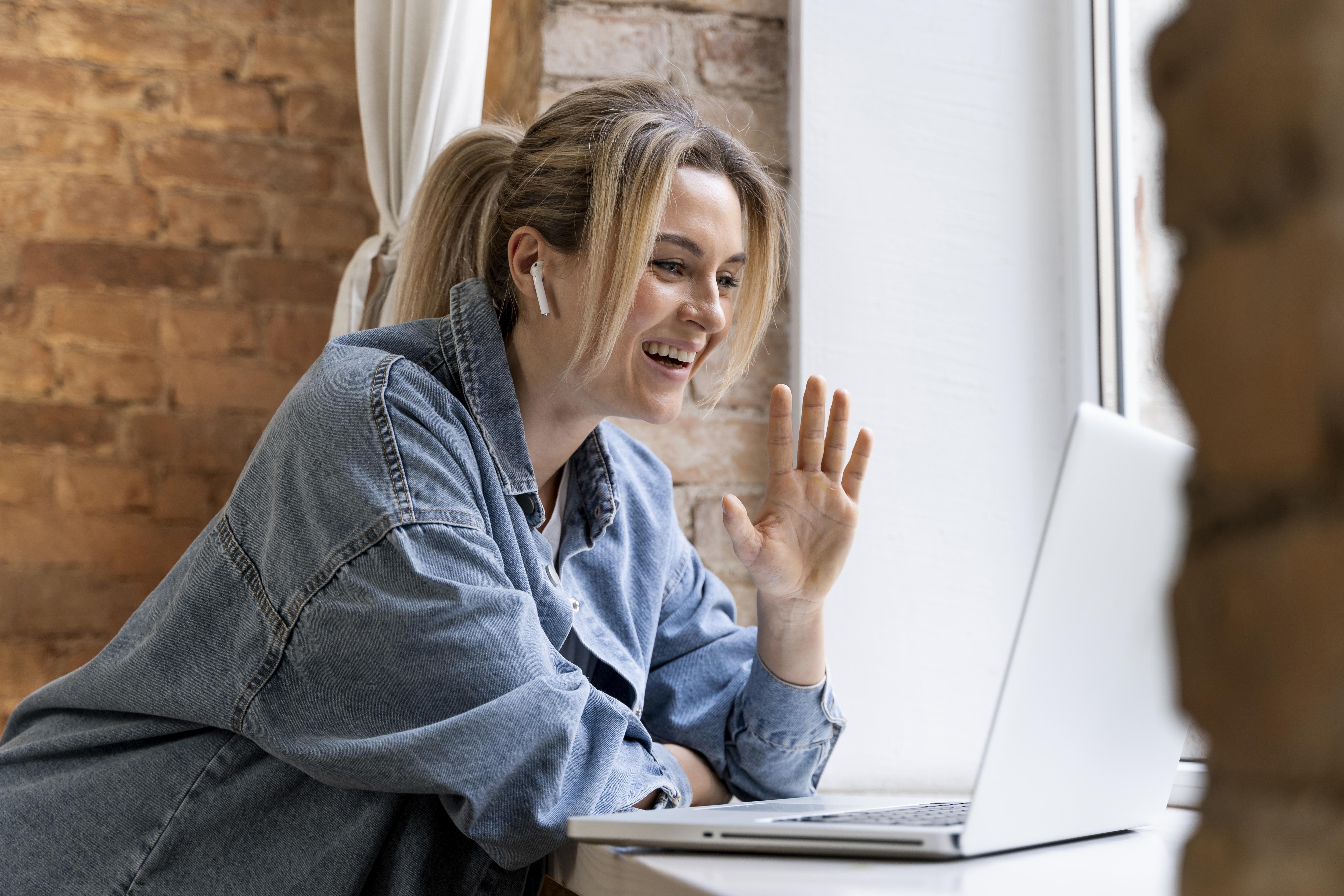 Woman using Skype for a video call, symbolizing personal connection through digital communication